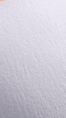 a close up of a piece of white paper on a table