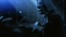 darth vader is standing in a dark room with a blue background