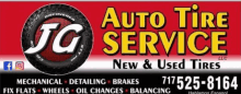 a sign for auto tire service with a tire on it