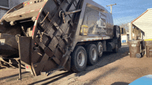 a garbage truck that says white bear waste on it