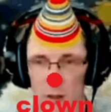 a man wearing headphones and a clown hat has the word clown on his face