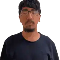 a pixelated image of a man with a beard and glasses