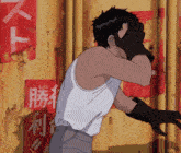 a man in a white tank top stands in front of a wall with chinese writing