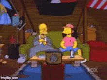 homer simpson and bart simpson are sitting on a couch