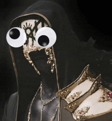 a person with big googly eyes is holding a pair of shoes