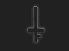 a glowing inverted cross on a black background .