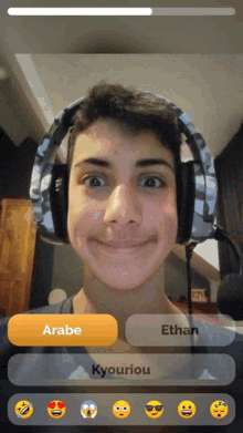 a young man wearing headphones with the name ethan on the bottom right