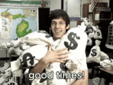 a man is holding a large pile of money bags with the words good times written on the bottom