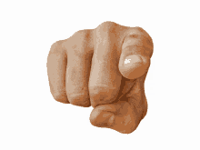 a close up of a person 's fist pointing at something