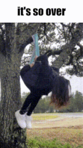a person is hanging upside down from a tree with the words it 's so over above them