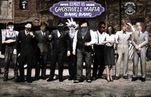 a group of people standing in front of a sign that says ghostwell mafia