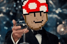 a man in a tuxedo is holding a glass of wine with a mushroom on his head .