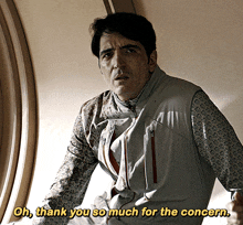 a man in a vest is saying oh thank you so much for the concern