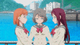 three anime girls are standing next to each other holding hands