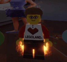 a lego man wearing a white shirt that says i love legoland