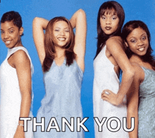 a group of women standing in front of a blue background with the words thank you on it