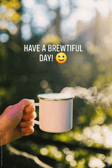 a person is holding a cup of coffee with the words have a brewtiful day written above it