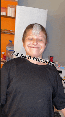 a boy wearing a black shirt with az sum ednorog written on his neck