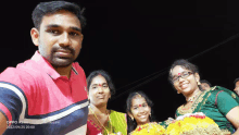 a man in a pink shirt takes a selfie with his family and the date of september 25th