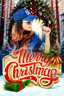 a woman wearing a blue hat with the number 50 on it stands in front of a merry christmas sign