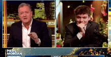 piers morgan is talking to a man on a television show