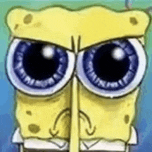 a close up of spongebob squarepants ' face with big eyes and a sad look on his face .