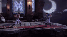 two men are fighting in a video game with a crescent moon behind them