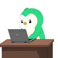 a cartoon penguin is sitting at a desk with a dell laptop