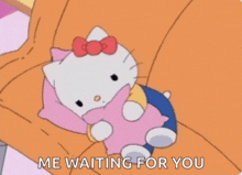 hello kitty is laying on a couch holding a pink pillow and says me waiting for you