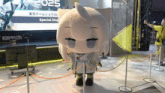 a mascot in front of a sign that says 2025 special stage
