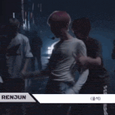 a man with pink hair is wearing a shirt that says chenle on it
