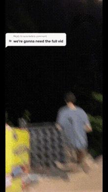 a blurry picture of a man walking in the dark with a reply to another person 's comment .