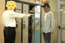 a man is pointing a gun at another man in front of a locker with a sticker that says reals