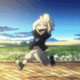 a boy in a black shirt with a skull on it jumps in the air