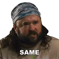 a bearded man wearing a bandana and a shirt that says same