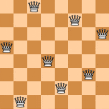 a chess board with a pattern of crowns on each square