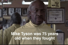 a man with the words mike tyson was 75 years old when they fought below him