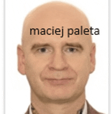 a bald man with the word maciej paleta written on his forehead