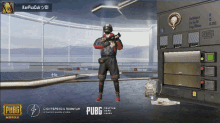 a man holding a gun in a room with pubg mobile on the bottom