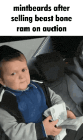 a baby sitting in the back seat of a car holding a piece of paper that says mintbeards after selling beast bone