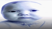 a baby 's face is shown with a serious look on it 's face