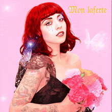 a woman with red hair is holding flowers in front of a pink background with the words mon laferte on it