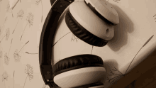 a pair of black and white headphones laying on a table