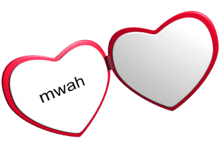 two red heart shaped mirrors with the word mwah on one of them