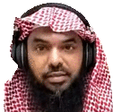 a man with a beard and headphones is wearing a red and white scarf .