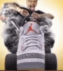 a man is sitting on a lawn mower wearing a pair of jordan sneakers