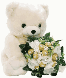 a white teddy bear holds a bouquet of flowers and chocolates