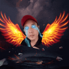 a man with a red hat and blue eyes has flaming wings on his face