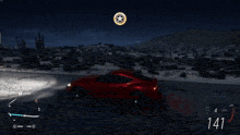 a red sports car is driving down a desert road at night and the speedometer reads 157