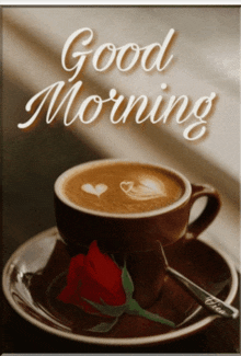 a cup of coffee on a saucer with a rose and the words " good morning " on the bottom